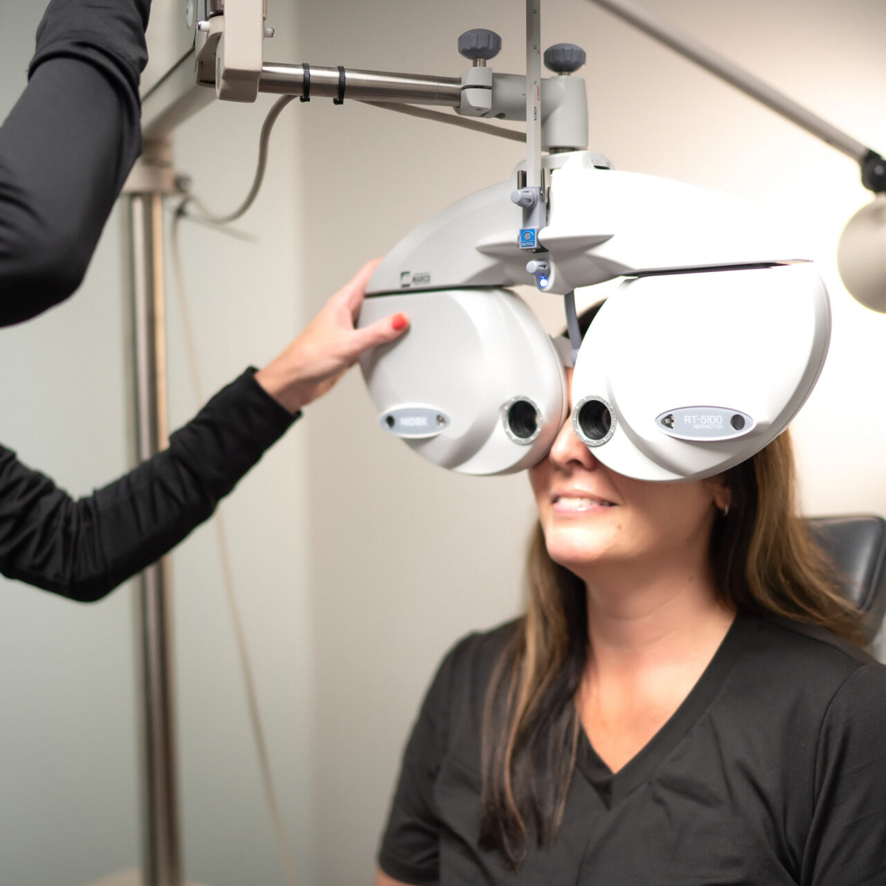 DSC04159 Dr. Becky runs a routine eye exam on young woman